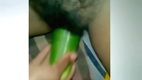Indian babe masturbates with a cucumber after masturbating