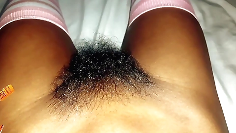 Indian schoolgirl in stockings is filmed in a solo scene