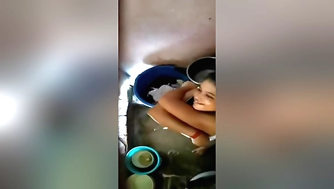 Indian girl stretches in the bathroom in the camera clip