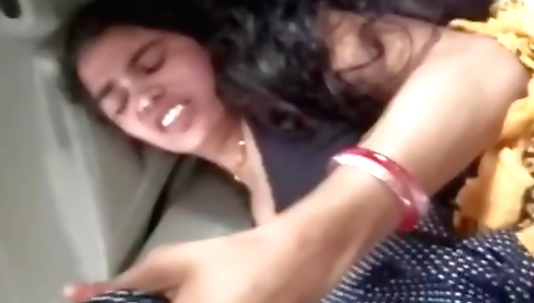 Indian brunette in a car is having sex on the seat
