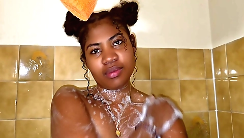 Sexy babe with a shaved pussy is taking a passionate caress