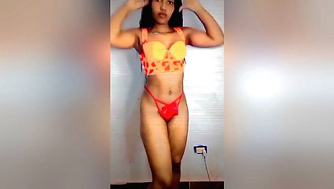 Cute brunette in a sexy skirt and blouse exchanging clothes