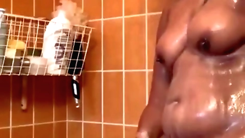 Sexy brunette takes care of her pussy in the shower