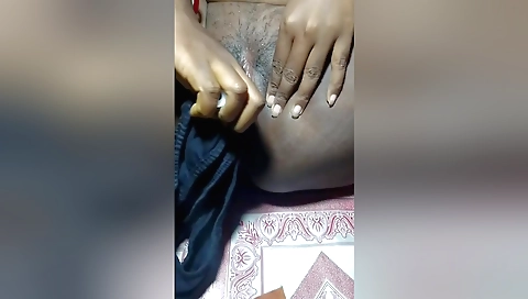 Indian amateur solo female takes care of her pussy