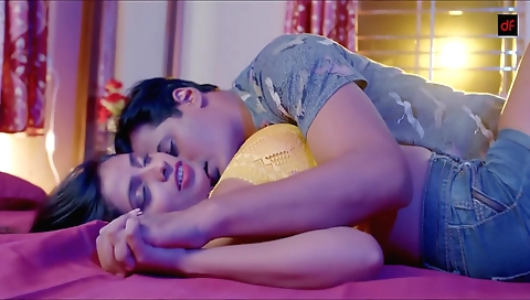 Amateur brunette with natural skin is painting on bed