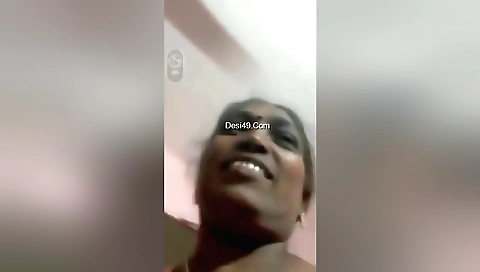 Mature amateur showing her big tits in a solo video