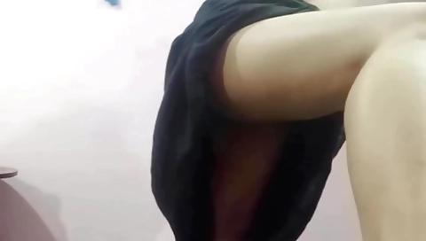 Brunette girl in a pink bikini plays with her pussy