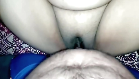 Indian girl in her laptop looks at computer screen