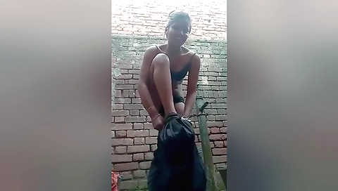 Outdoor solo female is fingering and wetting herself