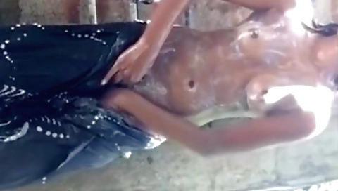 Hot Indian brunette bathed in the sun in the beach