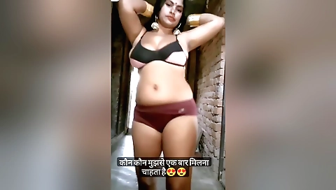 Bhabhi bina is wearing a black bikini and dancing on the beach